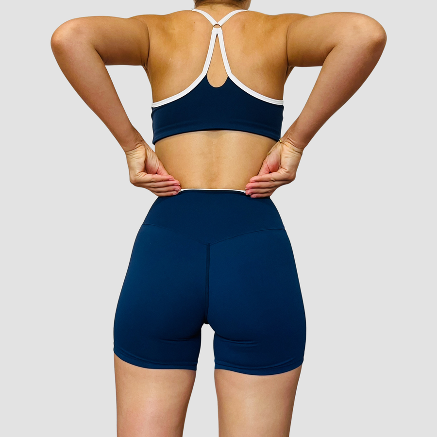 Stella – ensemble short brassière contrasté OraFit, coloris bleu marine vue de dos [partagée avec Stella - Short contrasté et Stella - Brassière contrastée]